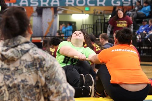 Monica Ishnook of Koliganek competes against an Anchorage student in Eskimo Stick Pull 