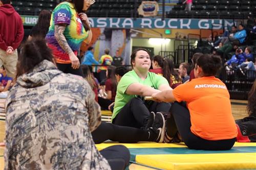 Monica Ishnook competes against a student from Anchorage School District in the Eskimo Stick Pull.