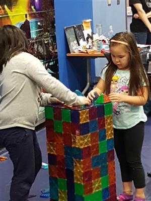 Girls building a tower  