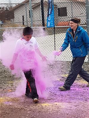 Boy covered in colored powder from the Color Run  