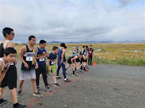 male runners lining up to race 